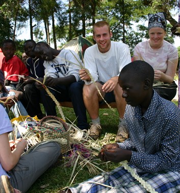Learning basket weaving in Africa