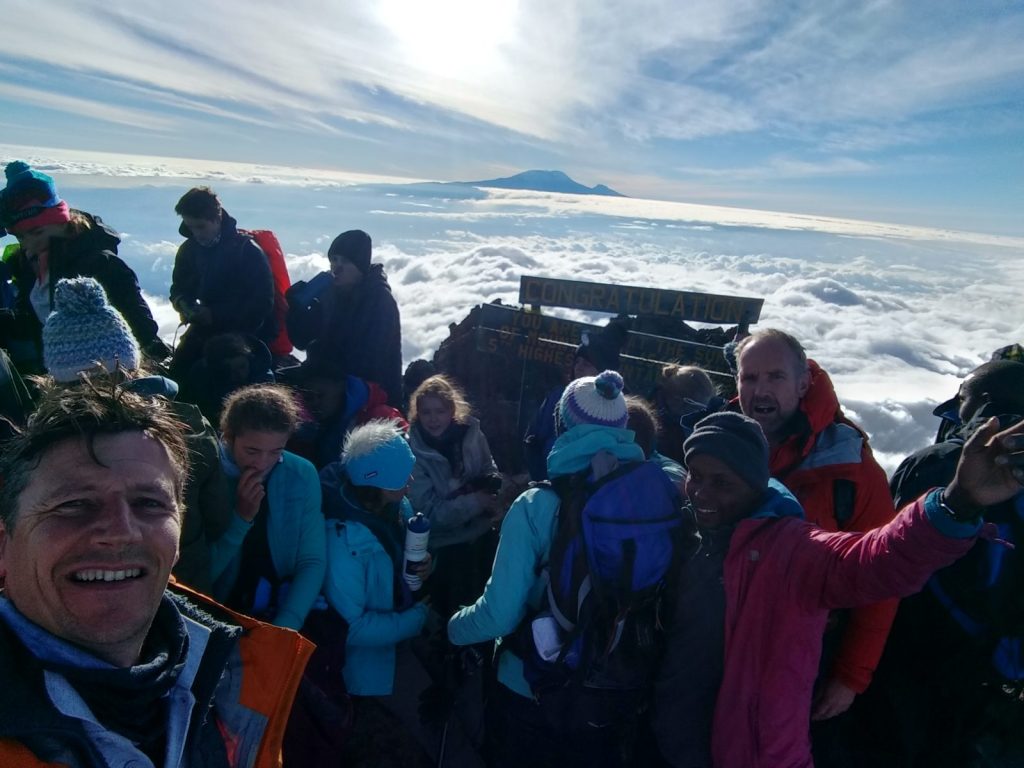 Summit of Mt Meru Tanzania with Kilimanjaro in the background